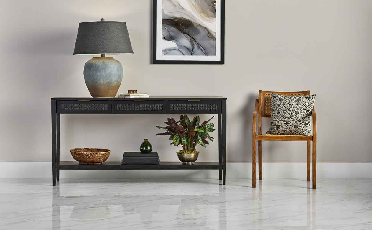 White and grey marble tile with accent table and chair. 